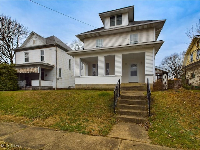 view of front of property with a porch and a front yard