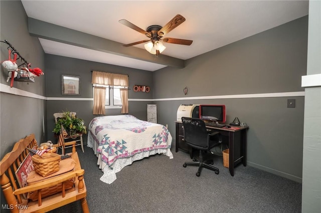 carpeted bedroom with a ceiling fan and beam ceiling