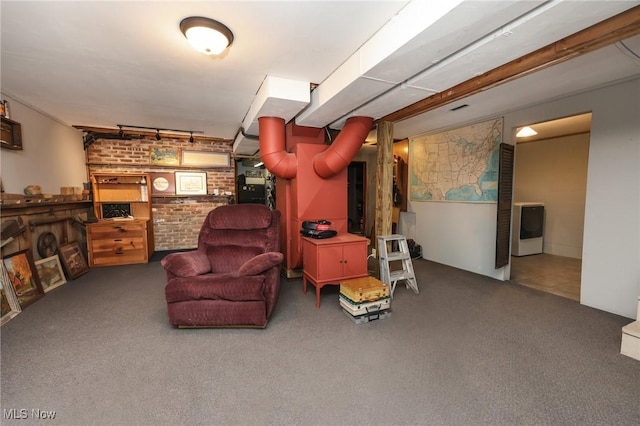 interior space with brick wall and carpet