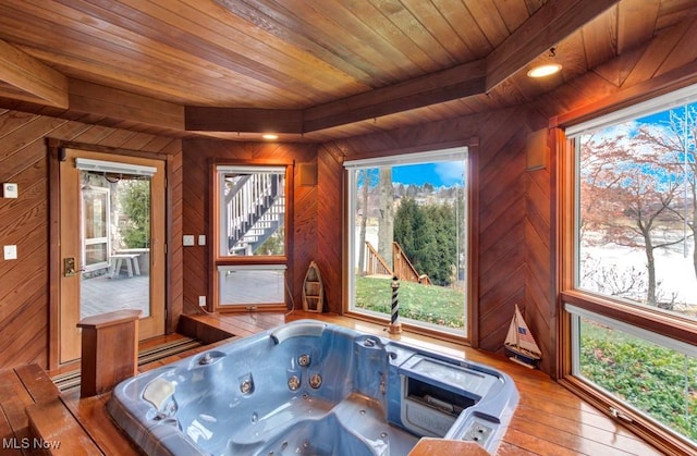 playroom featuring wood ceiling, wooden walls, a hot tub, and hardwood / wood-style floors