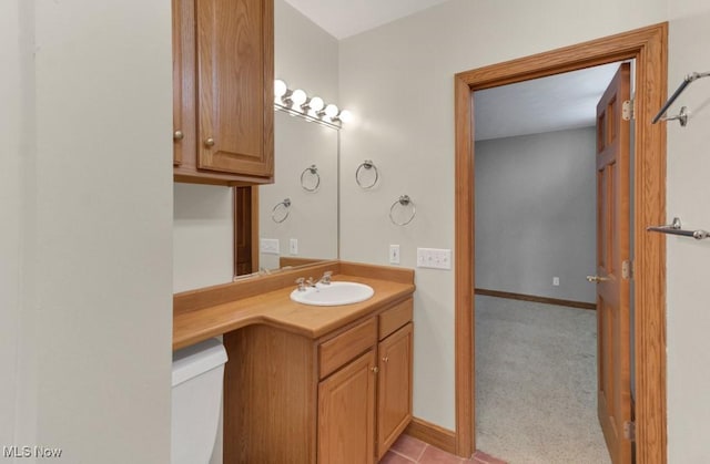 bathroom featuring vanity and toilet