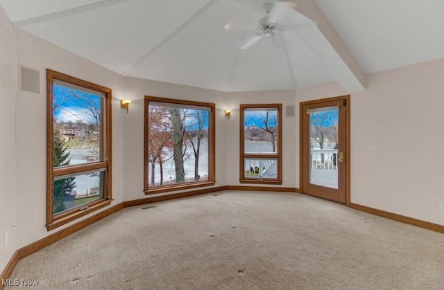 unfurnished room featuring ceiling fan, lofted ceiling, and light carpet