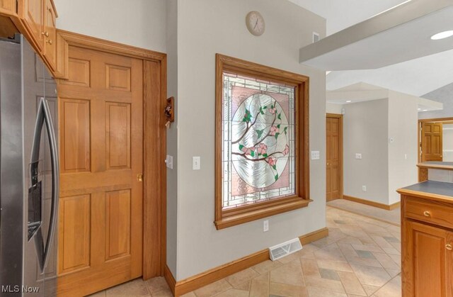 interior space with stainless steel fridge