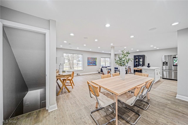 dining space featuring light wood-type flooring