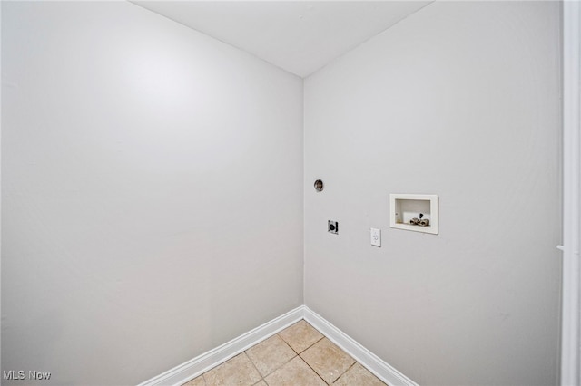 laundry area featuring electric dryer hookup, washer hookup, and light tile patterned floors