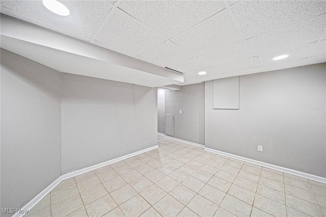 basement featuring a drop ceiling