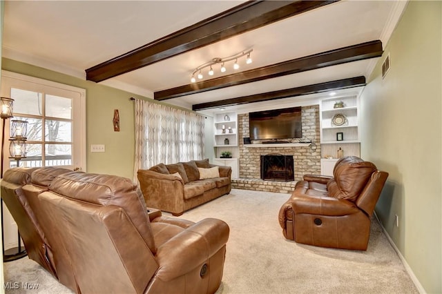 carpeted living room featuring beamed ceiling, a fireplace, built in features, and crown molding