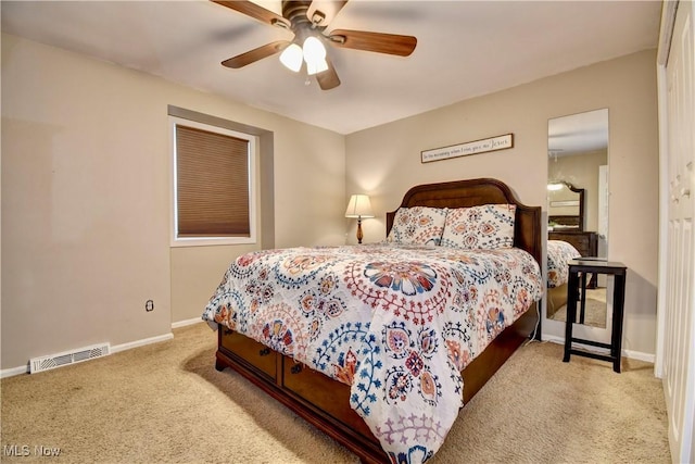 carpeted bedroom featuring ceiling fan