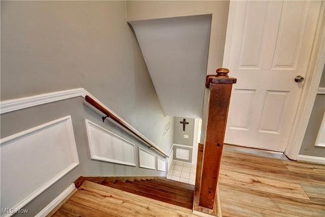 staircase featuring hardwood / wood-style flooring