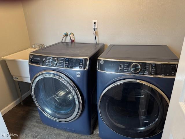 laundry area featuring separate washer and dryer and sink