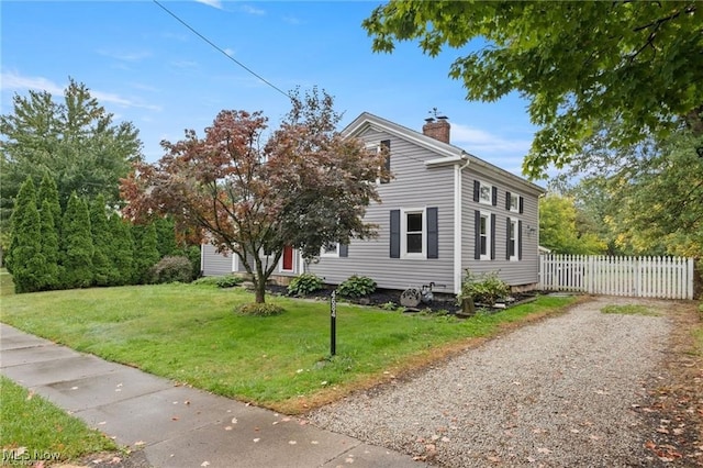 view of home's exterior with a yard