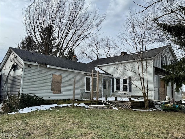 view of front of house with a front lawn and a deck