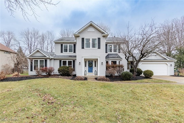 front of property with a garage and a front lawn