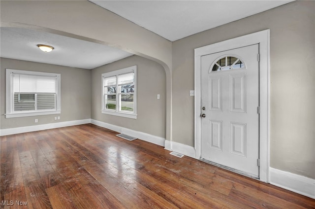 foyer entrance featuring dark hardwood / wood-style floors