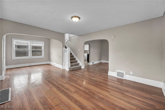 spare room with hardwood / wood-style floors