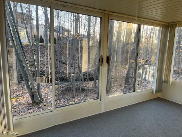 unfurnished sunroom with a healthy amount of sunlight