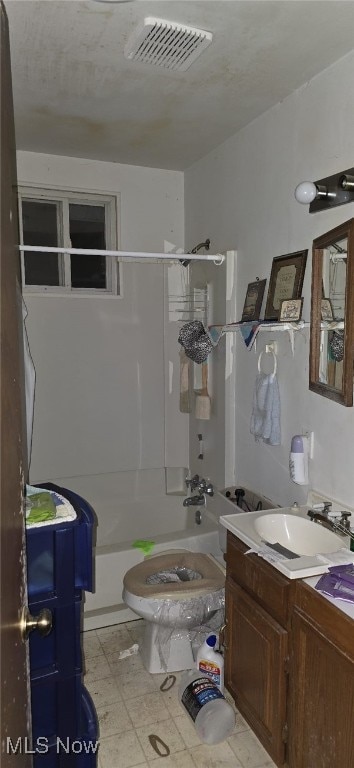 full bathroom with shower / bath combination, vanity, and toilet