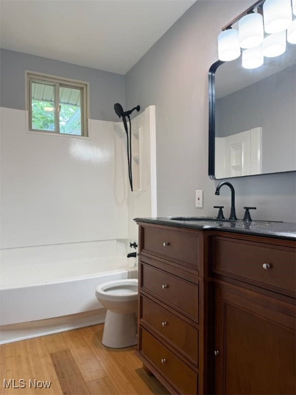 950 Donmar Ln, Boardman, OH 44511 - bathroom with vanity, wood finished floors, and shower / bathtub combination