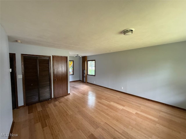 950 Donmar Ln, Boardman, OH 44511 - unfurnished bedroom with light wood-style floors and baseboards