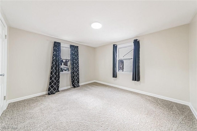 empty room featuring carpet flooring