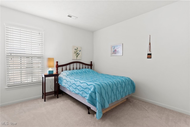 bedroom with light carpet