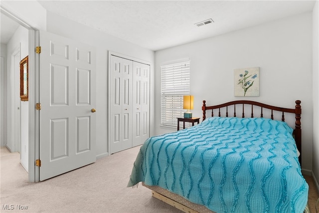 carpeted bedroom with a closet