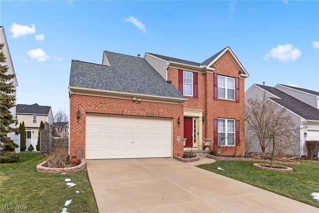 view of front of home with a garage and a front lawn