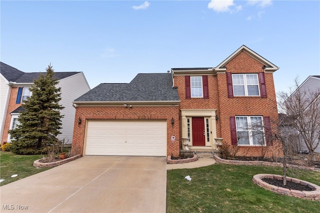 view of front of house with a garage and a front lawn