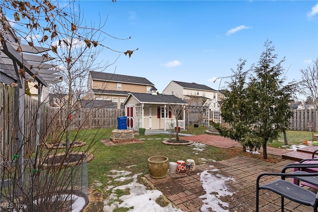 view of yard with an outbuilding and a patio