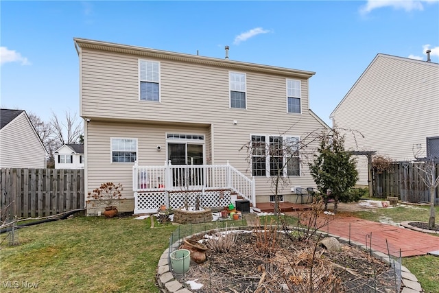 back of property featuring a patio and a lawn