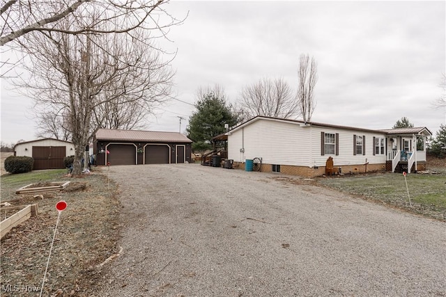 view of property exterior with an outbuilding and a garage