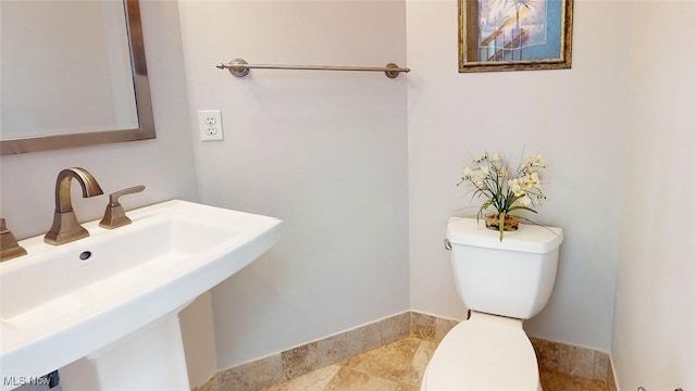 bathroom with sink and toilet