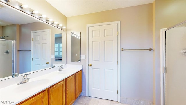 bathroom with vanity and walk in shower