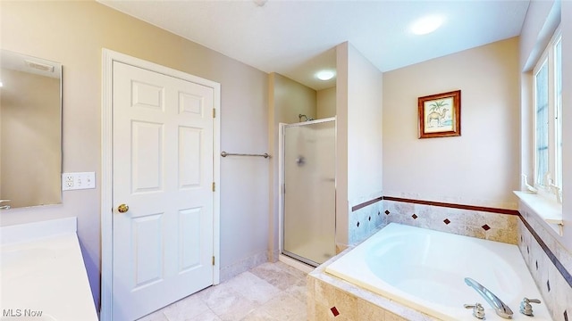 bathroom with shower with separate bathtub and vanity