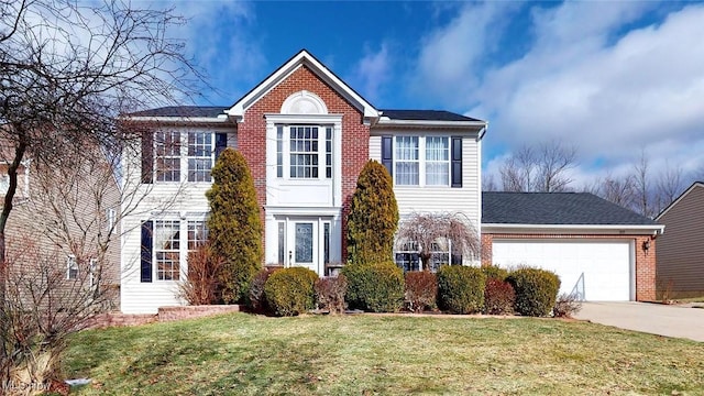 view of front facade featuring a garage and a front yard