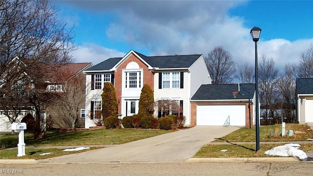 view of front of home featuring a garage and a front yard