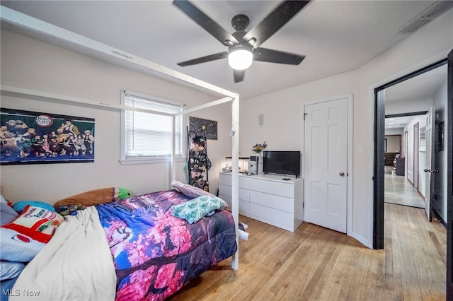 bedroom featuring ceiling fan and light hardwood / wood-style flooring