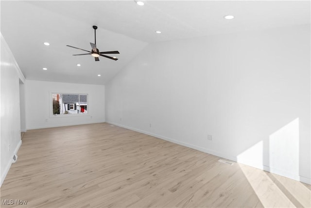 unfurnished living room featuring vaulted ceiling, ceiling fan, and light hardwood / wood-style floors