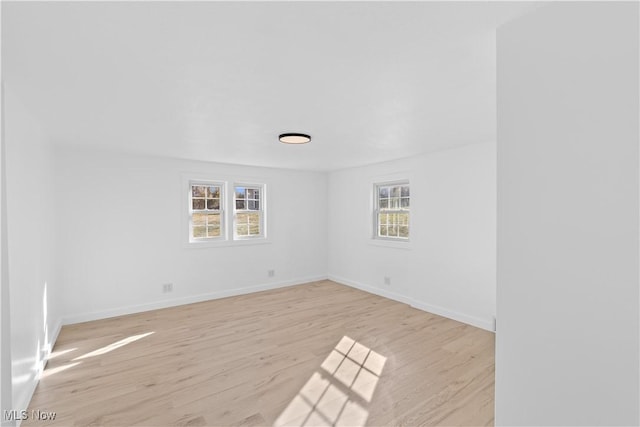 spare room featuring light hardwood / wood-style floors