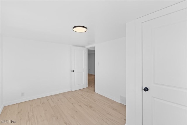 empty room with light wood-type flooring