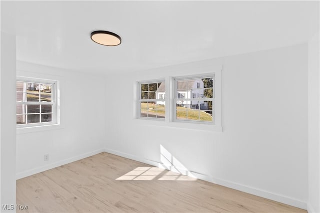 spare room with light hardwood / wood-style floors