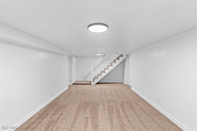 basement featuring carpet flooring