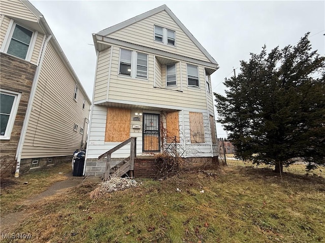 view of front of home with a front yard