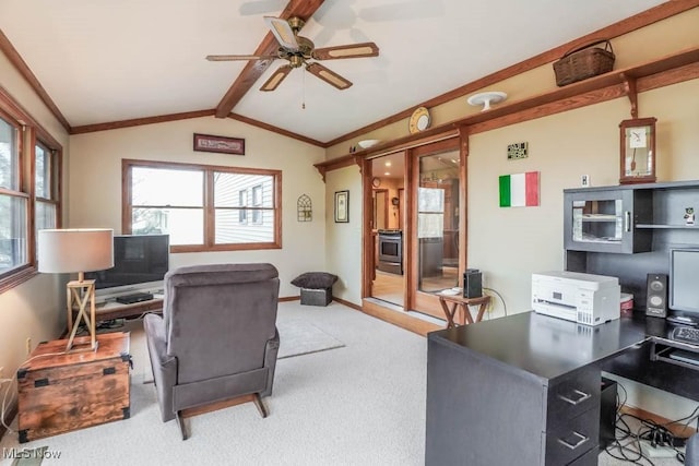 carpeted office space with lofted ceiling with beams, crown molding, and ceiling fan