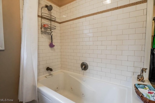 bathroom with shower / bath combo with shower curtain