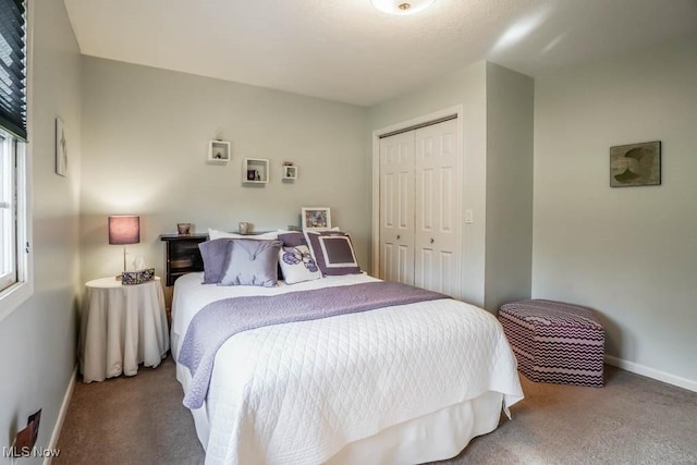 bedroom featuring a closet and carpet