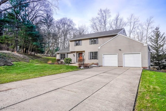 view of front of property featuring a garage and a front yard