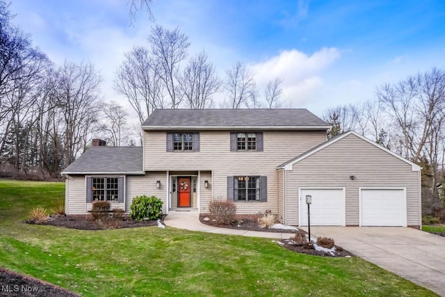 front of property featuring a garage and a front yard