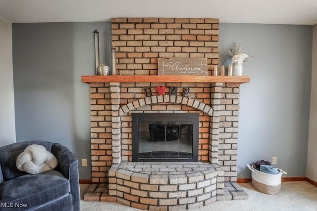 details with carpet flooring and a brick fireplace