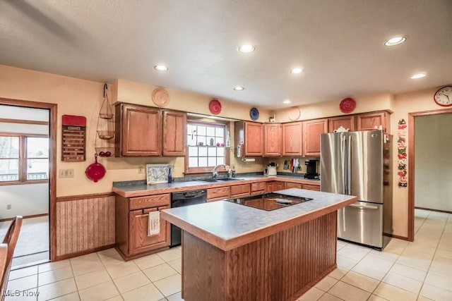 kitchen with light tile patterned flooring, a center island, sink, and black appliances